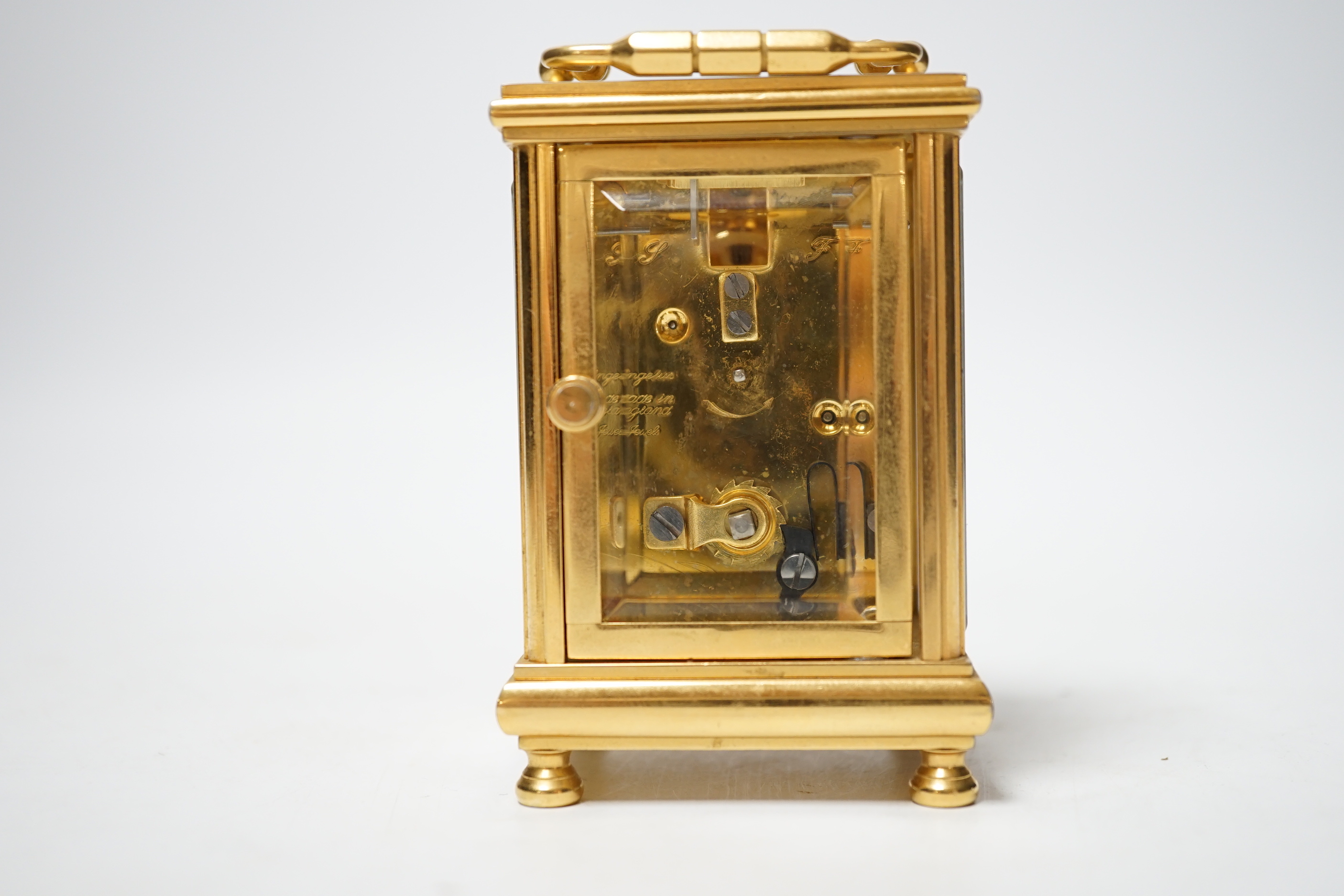 An Angelus miniature brass cased carriage clock with key, 9cm